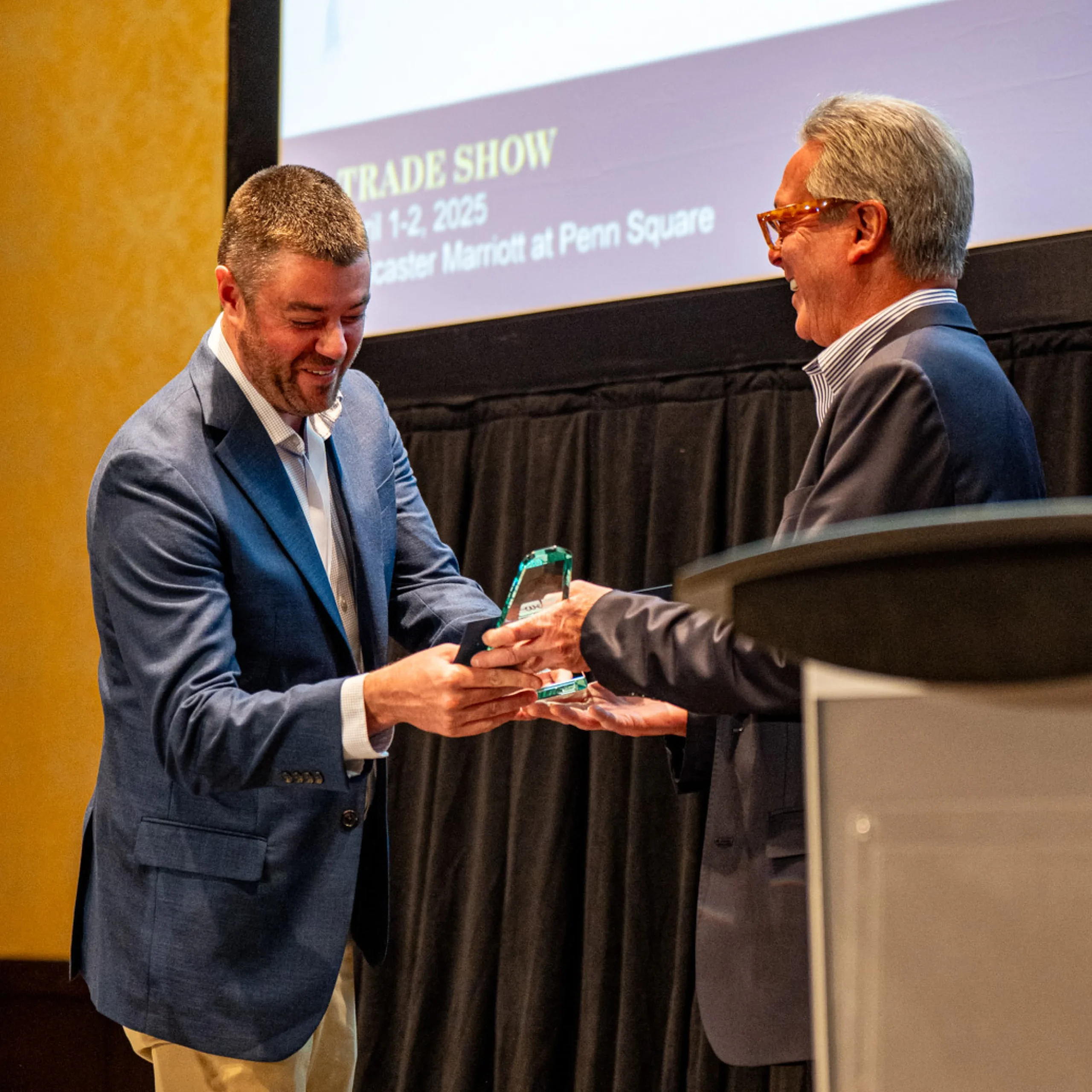 Ryan Accepts Award on Customers Behalf
